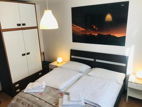 Postel nebo postele na pokoji v ubytování Residence Alpen Casavacanze