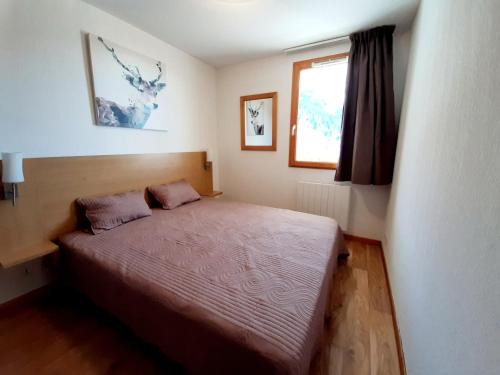 Cama ou camas em um quarto em Agence Des Orres - Les Chalets de Bois Méan - T2 - BME02