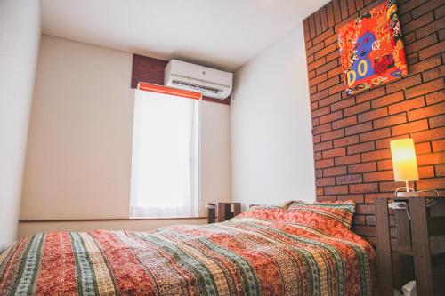 Postel nebo postele na pokoji v ubytování Niseko Hirafu Tsukushi