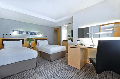 Postel nebo postele na pokoji v ubytování Kew Green Hotel Wanchai Hong Kong