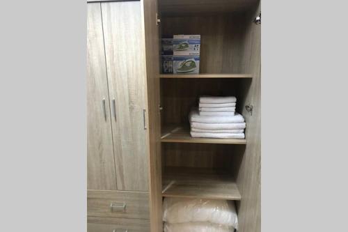 a closet with white towels on a shelf at Beauty Home Orestiada Center in Orestiada