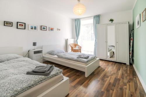 Кровать или кровати в номере Fewo-Colonia Köln-Innenstadt