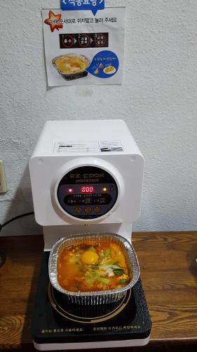 a food processor with a bowl of soup on it at Seong Dong Jang in Daegu