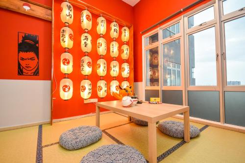 a room with a table and a wall with masks at Manhattan Theme Suite by Nest Home at Austin Heights in Johor Bahru