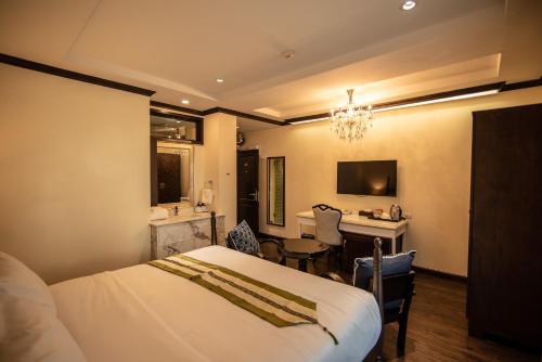 TV o dispositivi per l'intrattenimento presso Nanta Glam CM Hotel & Residences