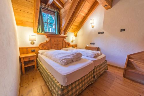 Ліжко або ліжка в номері Rifugio Lago Nambino