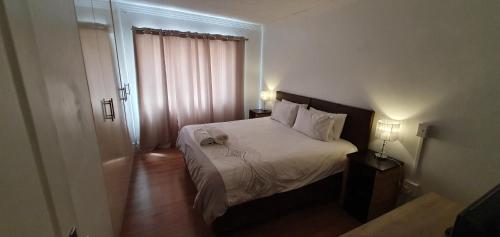 Ένα ή περισσότερα κρεβάτια σε δωμάτιο στο Beth El Guesthouse