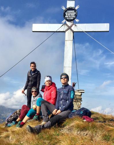 a group of people sitting in front of a windmill at Appart Gfall in Ried im Oberinntal