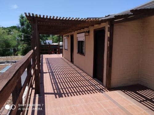 a wooden walkway outside of a house at Apartamentos Céntricos avenida Piria in Piriápolis