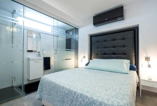 Posteľ alebo postele v izbe v ubytovaní Ciudad Blanca Apartment