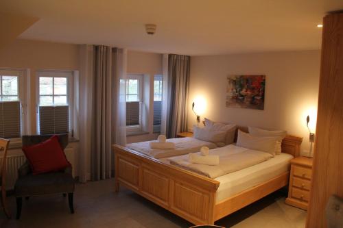 Säng eller sängar i ett rum på Hotel Weinhaus Möhle
