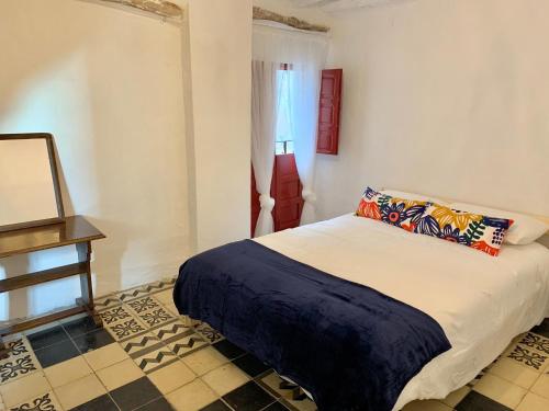 Uma cama ou camas num quarto em Tinao de Las Alcántaras