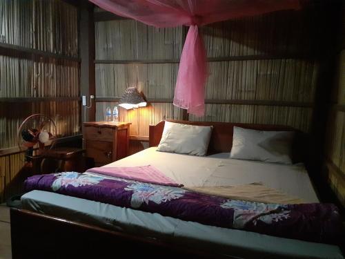 Posteľ alebo postele v izbe v ubytovaní Tribal Village Homestay & Trekking