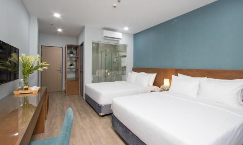 Postel nebo postele na pokoji v ubytování PIANO HOTEL