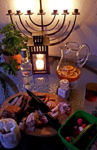 a plate of food with a knife on a table at Dom Gościnny Hansel & Gretel in Kallinowen