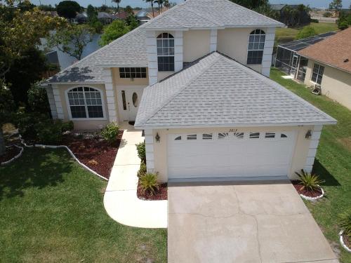 a house with a white garage at Mickey's Lake Villa 2 in Orlando