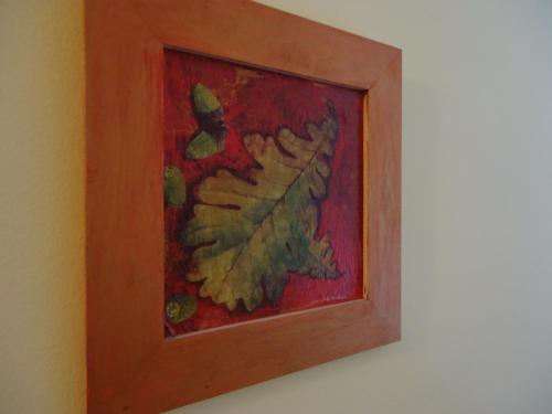 a painting of a bird in a frame on a wall at Czermann Panzió és Étterem in Oroszlány