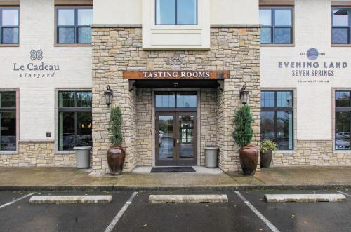 a building with a revolving door in a parking lot at The Dundee - A Trace Hotel in Dundee