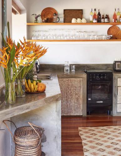 a kitchen with a counter with a vase of flowers at Diniview Villa Resort in Boracay