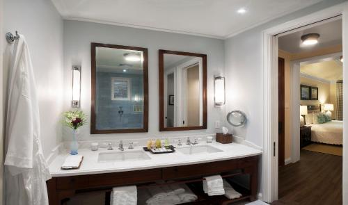a bathroom with a sink and a large mirror at Half Moon in Montego Bay