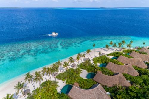 an aerial view of the beach at the excellence punta cana resort at Milaidhoo Maldives in Baa Atoll