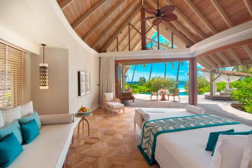 Postel nebo postele na pokoji v ubytování Milaidhoo Maldives