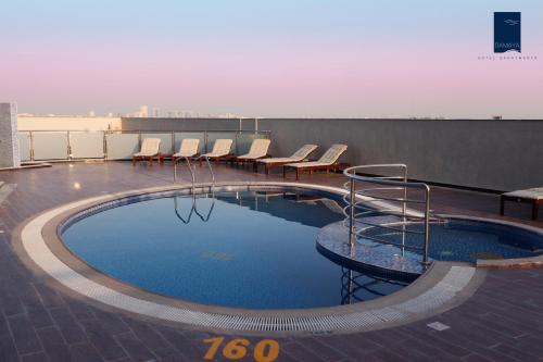 a swimming pool on the roof of a building at Samaya Hotel Apartment Dubai in Dubai