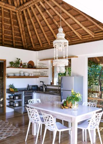 a kitchen with a white table and chairs at Diniview Villa Resort in Boracay