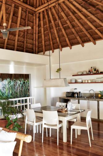 a dining room with a table and chairs at Diniview Villa Resort in Boracay