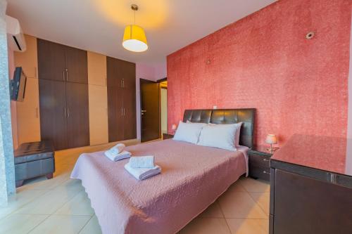 Ένα ή περισσότερα κρεβάτια σε δωμάτιο στο Deluxe Villa Kamba with Sea View