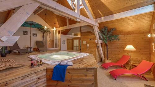 a large room with a swimming pool in a house at Panoramic Village - Locations vue Glaciers - Chez Philippe in La Grave