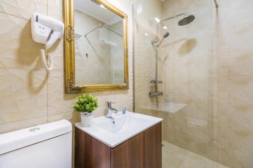 a bathroom with a sink and a shower at BUCUR 9 in Bucharest