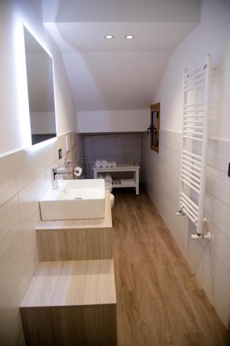 a bathroom with a white sink and a mirror at Etna Sunrise b&b in Zafferana Etnea