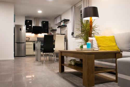 a living room with a couch and a table at Dom pod Magurką in Wilkowice