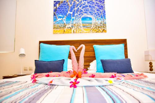 Cama o camas de una habitación en Cap Ouest Beachfront Residences