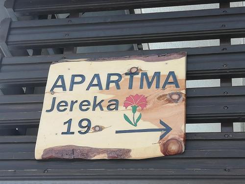 a sign that says aprilina jerusalem on a bench at Apartma pri Bregarju in Bohinj