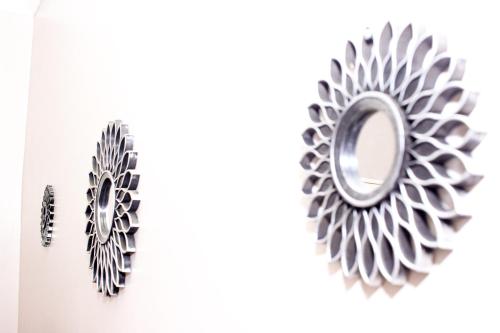 a pair of metal gears on a white background at Villa Prince in Harare