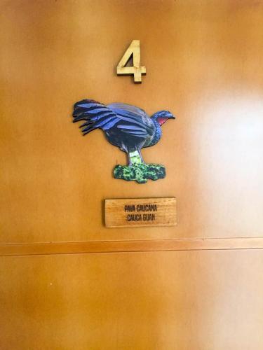 a painting of a bird on a wall at Cotinga Hotel Spa in Pereira