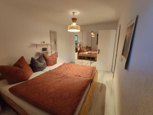 Postel nebo postele na pokoji v ubytování Ferienwohnung Dresden Pillnitz am Weinberg