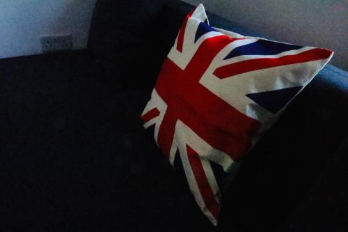 a pillow with a british flag on it at Luxury Suites near Wembley Stadium, Wembley Arena, London Designer Outlet in London