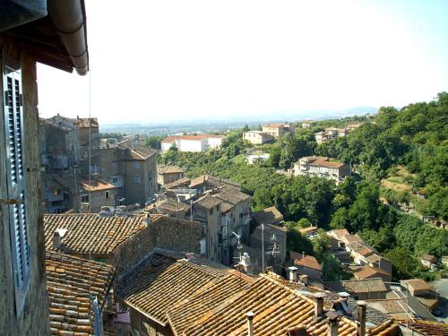 a view of a city with roofs and buildings at B&B La Rocca in Caprarola