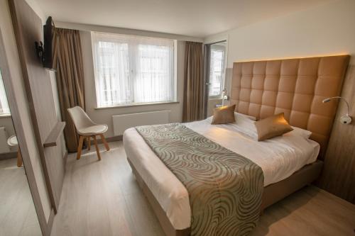 Postel nebo postele na pokoji v ubytování Hotel Atlanta Knokke