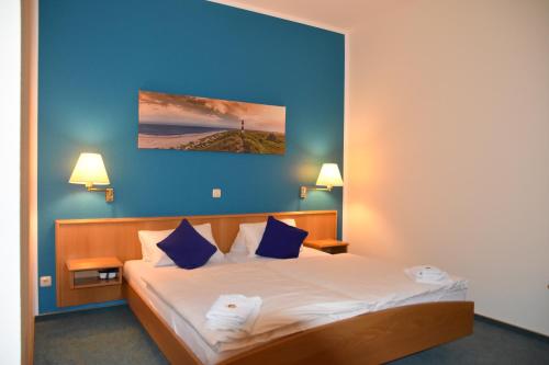 Postel nebo postele na pokoji v ubytování Hotel zum Gesundbrunnen