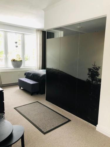 a bedroom with a large glass wall at Villa Waidhof in Schierke