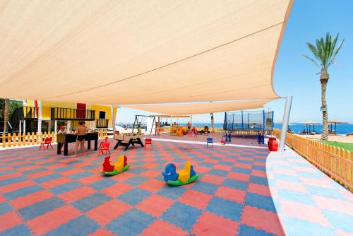 a rendering of a play area with toys under a tent at Amphoras Beach - Ultra All Inclusive in Sharm El Sheikh