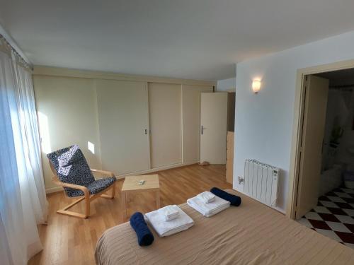 a bedroom with a bed and a chair and a chair at Son Veri D'Abaix in El Arenal