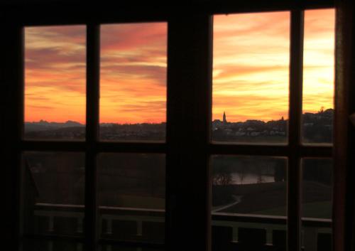 a view of a sunset from a window at Appartement Hauzenberg-Panorama in Hauzenberg