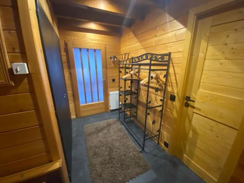 a room with a bunk bed in a wooden room at Haut de Chalet L'entasse n°9 in Valberg