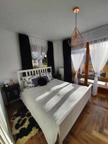 מיטה או מיטות בחדר ב-Apartament Gaia