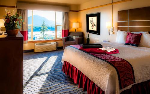a hotel room with a large bed and a window at Cape Fox Lodge in Ketchikan